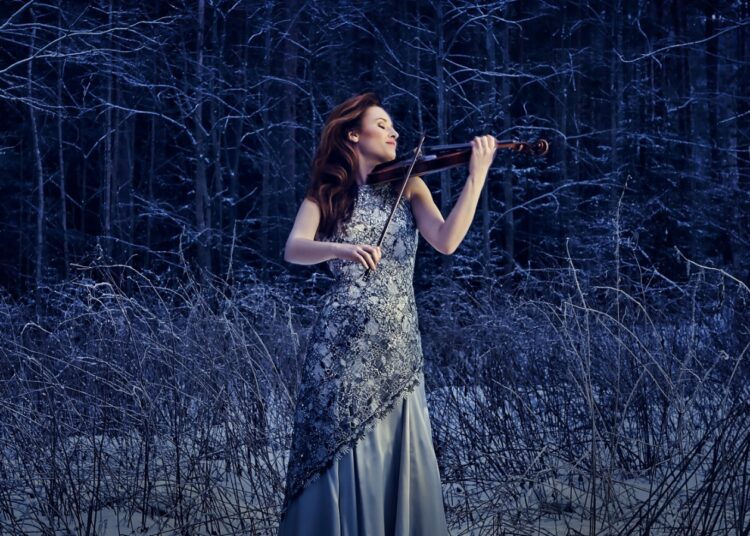 Violinist Ragnhild Hemsing performing outdoors on the cover of the 2L album Northern Timbre