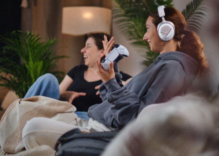 beyerdynamic MMX 100 wireless and MMX 130 wireless gaming headsets worn during a living room gaming session