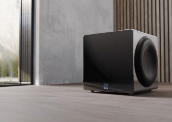 SVS 3000 R|Evolution EISA Award-winning 3000 Micro R|Evolution subwoofer beside a sofa