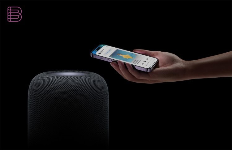 Apple HomePod (2nd generation) with an iPhone handing off audio playback