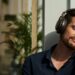 Man wearing the Audio-Technica ATH-AL5NC wireless open-back headphones
