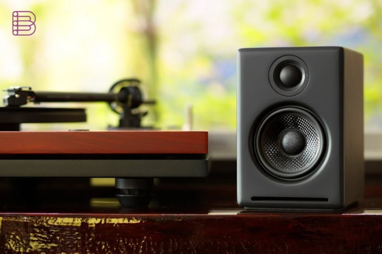 Audioengine A2+ Gen 3 speaker next to a turntable