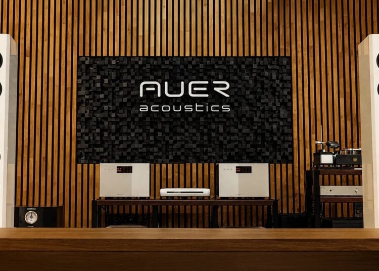 Pair of Auer Acoustics Versura V6 loudspeakers in a wood-paneled listening room
