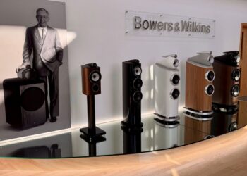 Bowers & Wilkins reception area in Worthing with a John Bowers portrait and five generations of loudspeakers