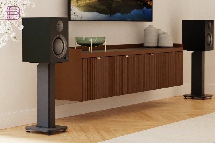 Kanto Tuk Grand speaker pair on stands in a living room