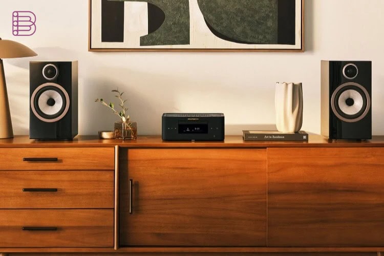 Marantz MCR 60n compact hi-fi system between a pair of bookshelf speakers in a living room