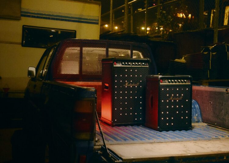 Marshall Bromley party speakers with illuminated grille at night