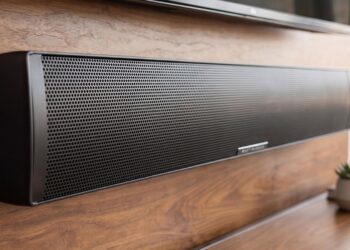 MartinLogan Motion Discrete Cinema soundbar mounted below a TV in a living room