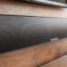 MartinLogan Motion Discrete Cinema soundbar mounted below a TV in a living room