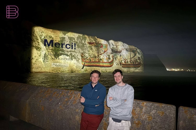 Pixel Sharp team members in front of the Panasonic PT-RQ35K2 Bayeux Tapestry projection on the White Cliffs of Dover