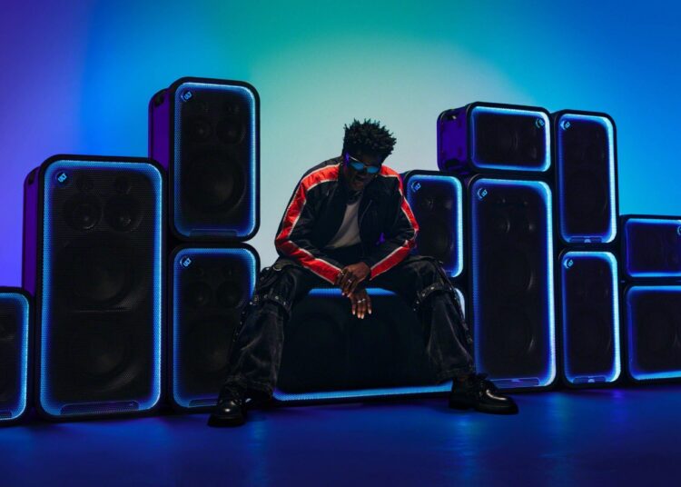 Sony ULT TOWER MAX, 7 and 5 party speakers with a model in a colourful lit party setting