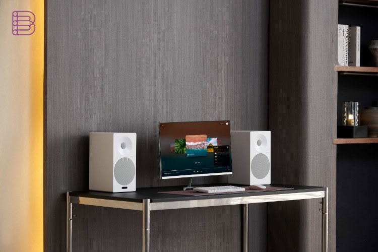 Tangent Spectrum II X5 Active BT speakers flanking a monitor on a desk