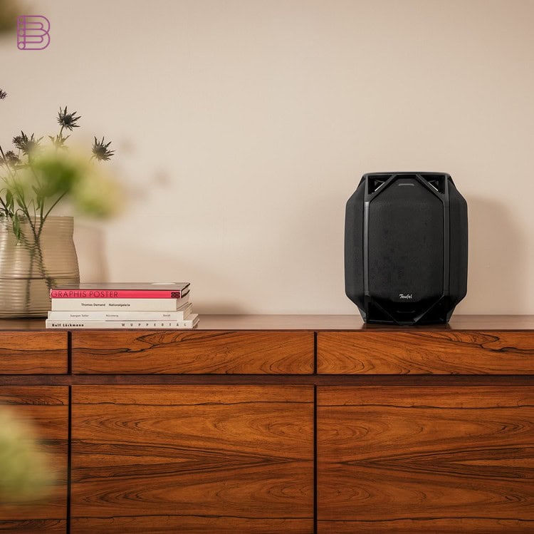 Teufel IKONIO wireless speaker in Night Black on a sideboard