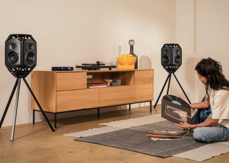Teufel IKONIO wireless speakers on tripod stands in a living room