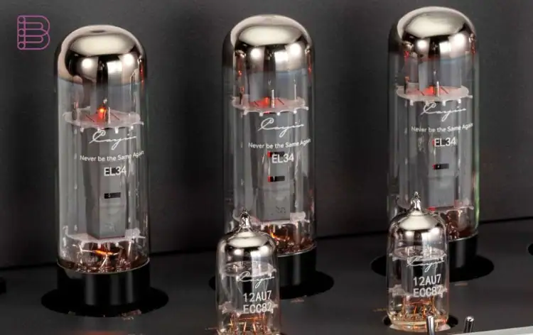Close-up of labeled EL34 output tubes and 12AU7 preamp tubes in a push-pull tube amplifier