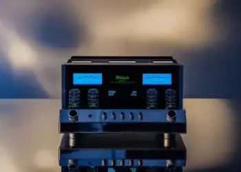 Glowing vacuum tubes and blue VU meters inside a McIntosh tube integrated amplifier