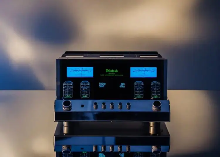 Glowing vacuum tubes and blue VU meters inside a McIntosh tube integrated amplifier