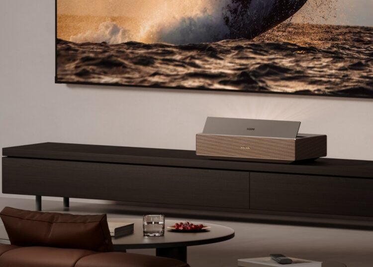 XGIMI Aura 3 Max ultra-short-throw laser TV projecting a huge image in a living room