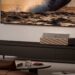 XGIMI Aura 3 Max ultra-short-throw laser TV projecting a huge image in a living room