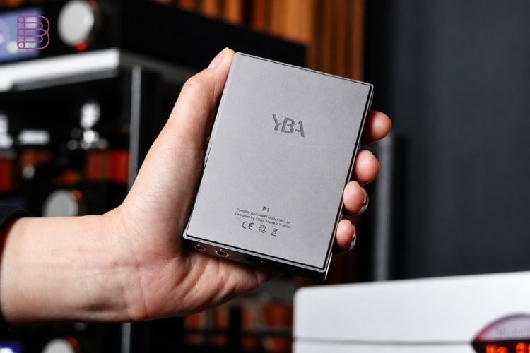 YBA VIBE P1 portable DAC held in hand next to a smartphone
