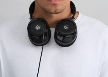 ADAM Audio H715 Reference open-back headphones worn around the neck