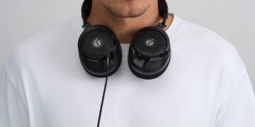 ADAM Audio H715 Reference open-back headphones worn around the neck
