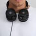 ADAM Audio H715 Reference open-back headphones worn around the neck