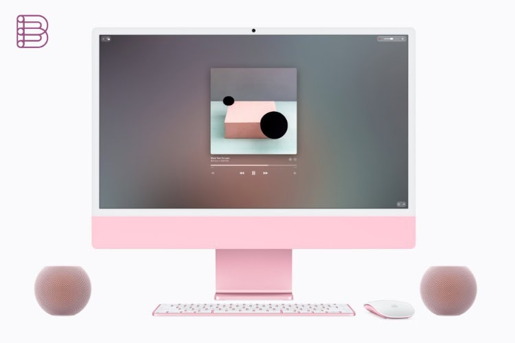 Two HomePod mini 2 speakers in pink alongside a coordinating iMac