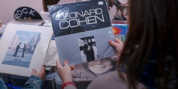Visitor browsing vinyl records at the Audio Video Show record fair