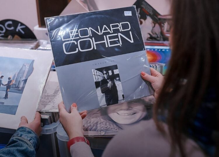 Visitor browsing vinyl records at the Audio Video Show record fair
