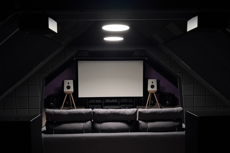 Marco Lisi’s reference listening room with projection screen and loudspeakers