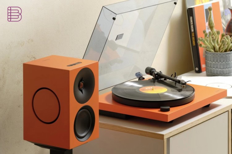 Cambridge Audio Spira turntable in the Orange finish with a matching active speaker