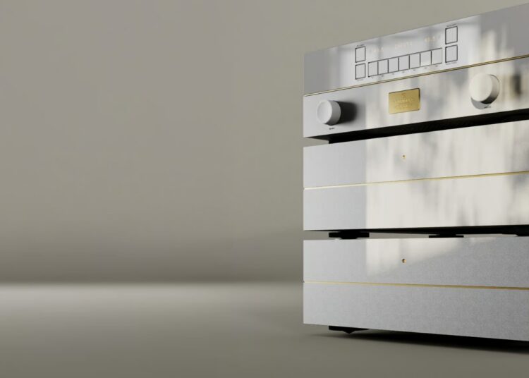 Goldmund Mimesis Statement preamplifier stack in silver with gold accents, two knobs and a display, against a soft taupe backdrop