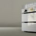 Goldmund Mimesis Statement preamplifier stack in silver with gold accents, two knobs and a display, against a soft taupe backdrop