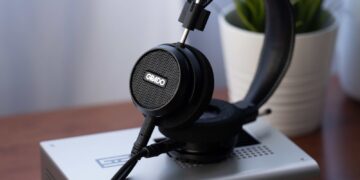 Grado Signature S150 open-back headphones resting on an amplifier