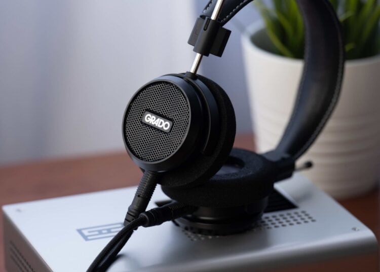 Grado Signature S150 open-back headphones resting on an amplifier