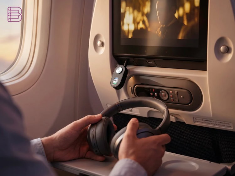 iFi UP Travel Max connected to an in-flight entertainment screen