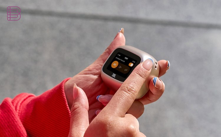 Hand operating the touchscreen on the JBL Smart Charging Case