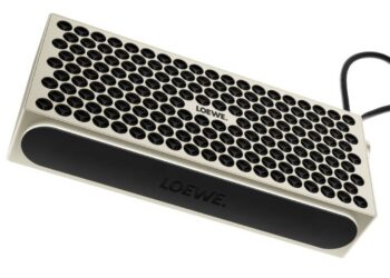 Loewe Neo portable Bluetooth speaker with aluminium grille and carry strap