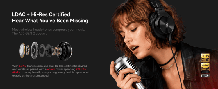 A singer wearing the OneOdio Fusion A70 A71 headphones in front of a microphone