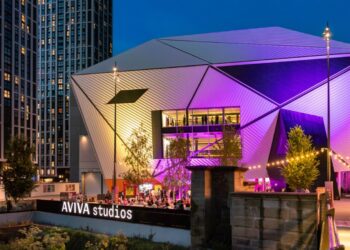 Aviva Studios, home of Factory International, lit up at night