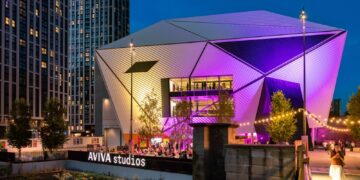 Aviva Studios, home of Factory International, lit up at night