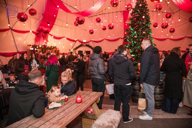 Interior dome projection of a Christmas market crowd scene at Gunwharf Quays