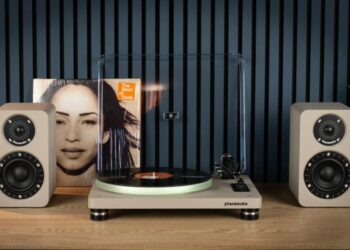 Phaze Audio Tilia Active bookshelf speakers in latte finish next to a turntable
