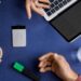 Plaud Note Pro AI voice recorder on a desk next to a laptop