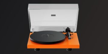 Pro-Ject Signal Orange Debut EVO 2 turntable on a dark background