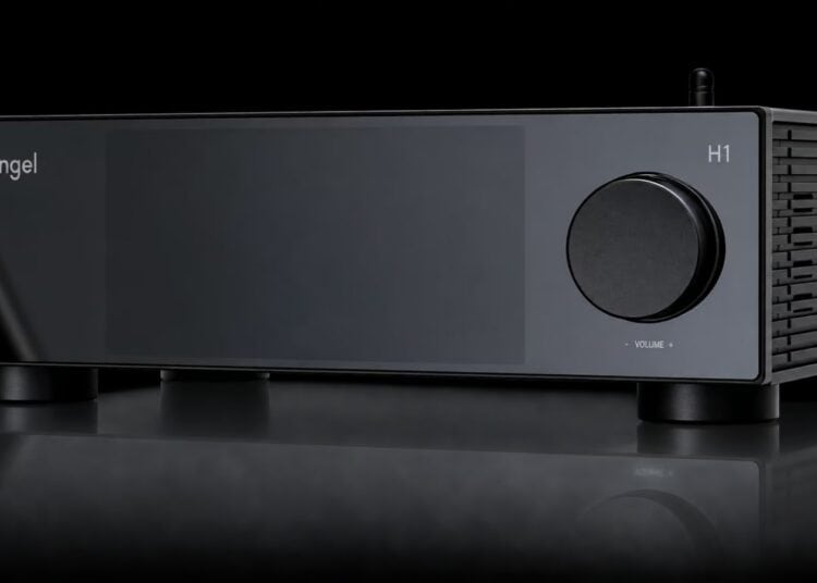 Silent Angel H1 Pure Music Hub in black with large volume knob, dark display panel and two antennas on a reflective surface