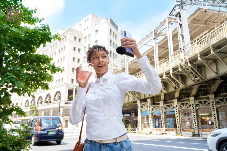 Sony ECM-AX10 microphone attached to smartphone for selfie video shooting