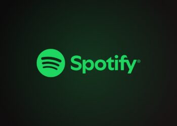 Spotify logo with green circle and sound waves beside the wordmark on a dark green-black gradient background