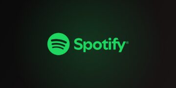 Spotify logo with green circle and sound waves beside the wordmark on a dark green-black gradient background